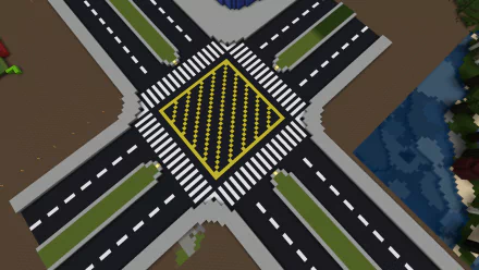 HD PC desktop wallpaper featuring a Minecraft-style road intersection with marked crosswalks and a yellow striped box in the center, showcasing a detailed video game environment.