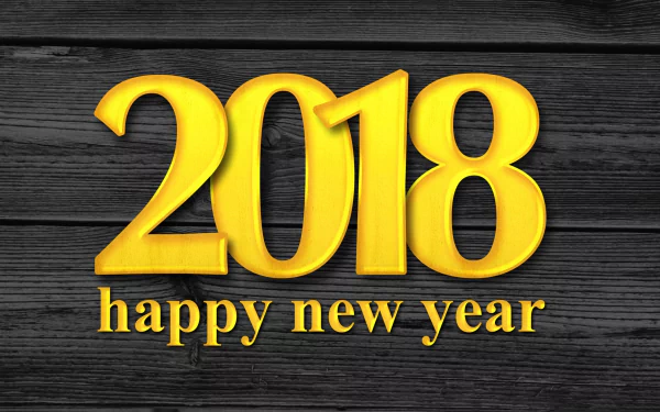HD desktop wallpaper and background celebrating New Year 2018 with bold yellow 2018 text and happy new year message on a dark wood texture.