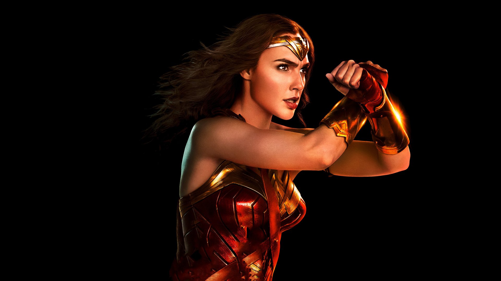 HD PC desktop wallpaper featuring Gal Gadot as Diana Prince/Wonder Woman from the 2017 movie Justice League in her iconic armor poised for battle.
