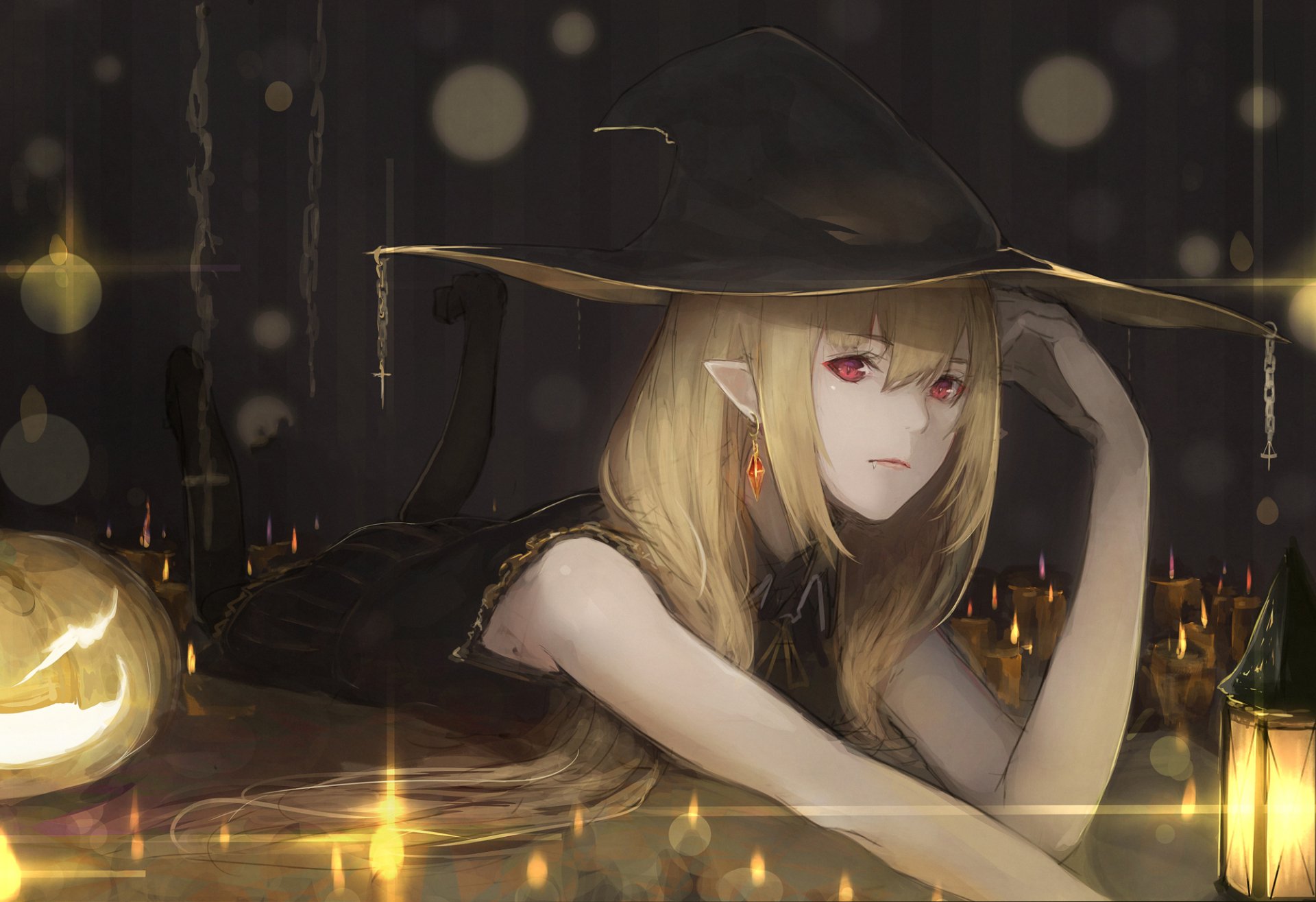 Anime girl with pointed ears and red eyes wearing a witch hat, surrounded by Halloween-themed pumpkins and lanterns. She has blonde hair and is resting her head on her hand. HD desktop wallpaper.