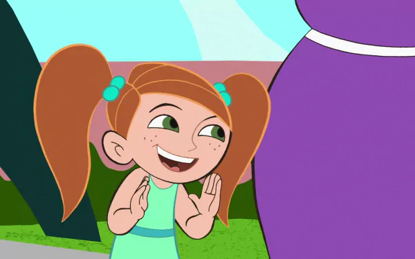 HD desktop wallpaper featuring a cheerful, young Kim Possible character from the TV show Kim Possible, smiling and clapping with her hands. Background includes a vivid outdoor setting.