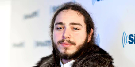 HD desktop wallpaper featuring a portrait of a man with facial tattoos and a fur coat.
