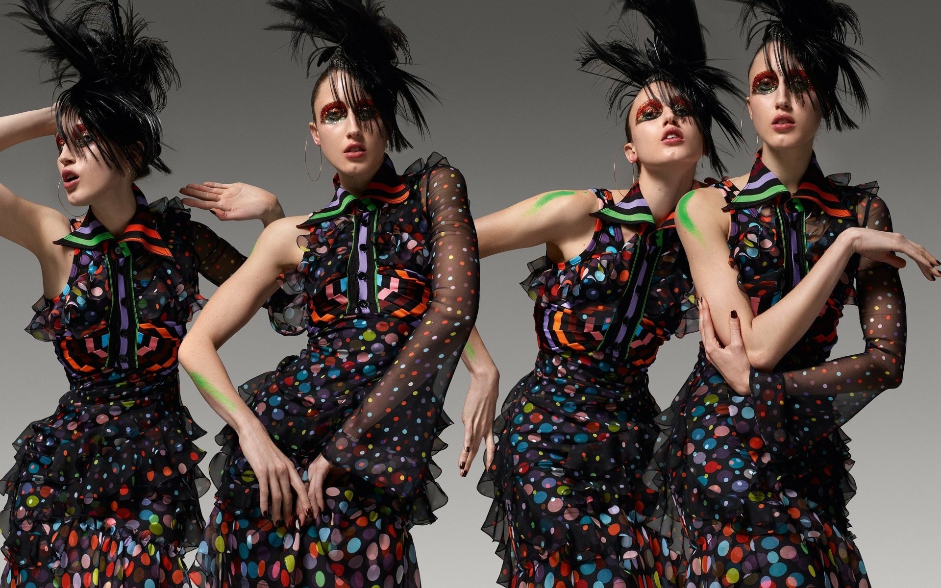 Woman model in a colorful textured dress with feathered headpiece striking four dynamic poses against a gray backdrop — 2K Quad HD PC desktop wallpaper/background.