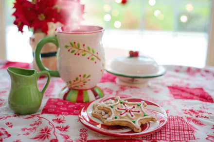 A 4K Ultra HD still life of Christmas cookies on a plate with a festive mug and creamer on a red and white tablecloth, creating a cozy holiday food scene.