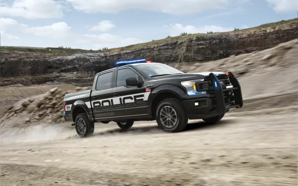 Black-and-white police vehicle Ford F-150 speeding across a dusty quarry road with lights flashing — 5K Ultra HD PC desktop wallpaper background.
