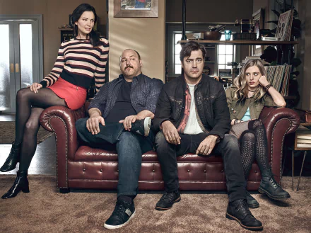 HD desktop wallpaper featuring four characters from the TV show Loudermilk posed in a vintage-style room.