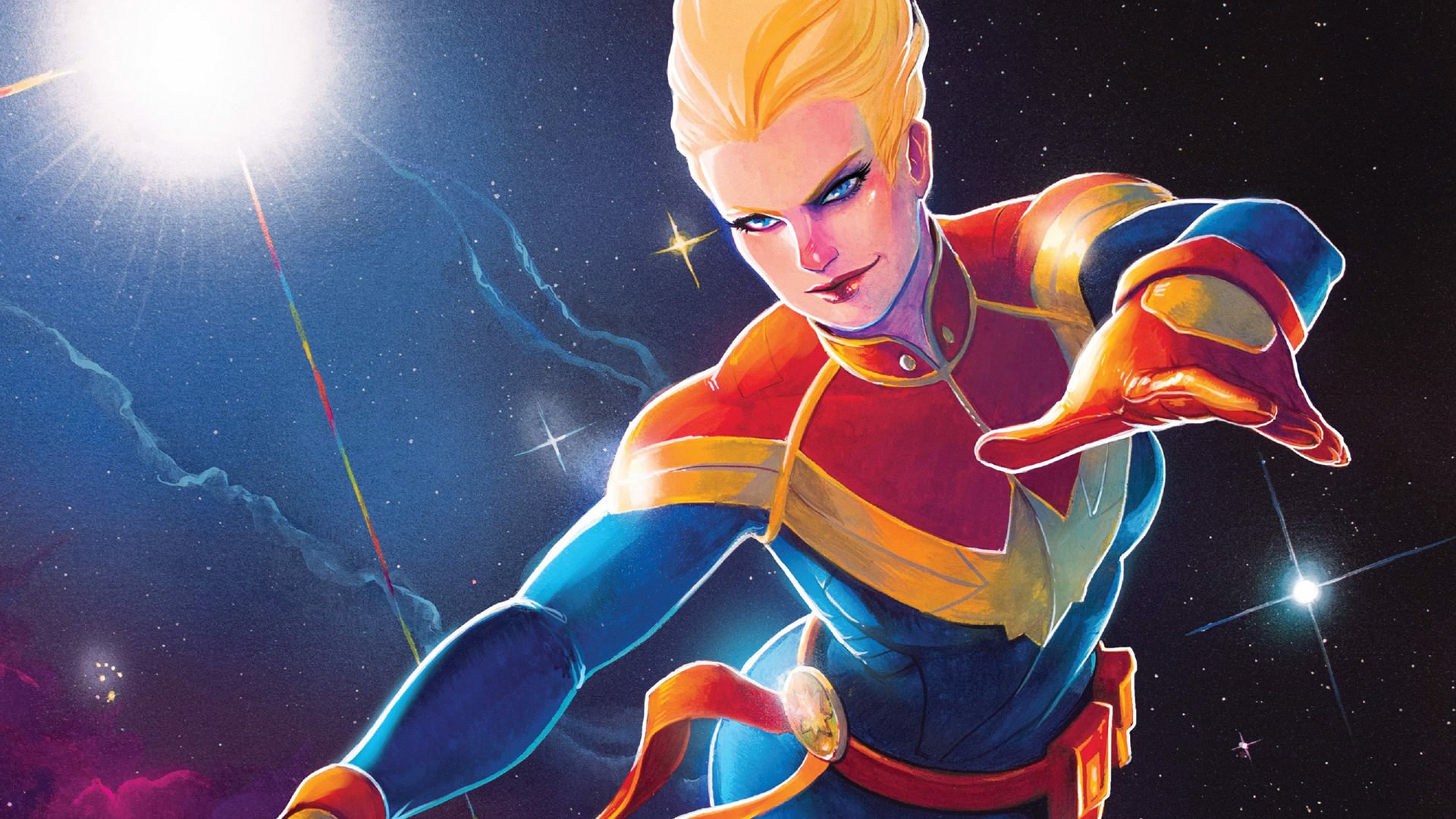 HD comic-style PC desktop wallpaper featuring Carol Danvers as Captain Marvel, depicted in vibrant colors with a dynamic cosmic background.