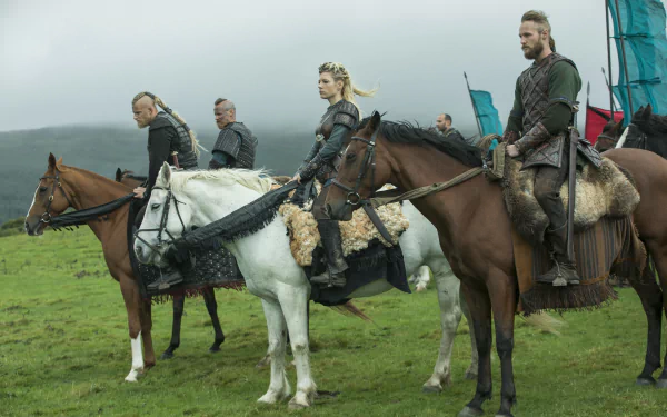 Vikings (2013) TV show 4K desktop wallpaper: Lagertha leading mounted warriors in armor across misty green plains.