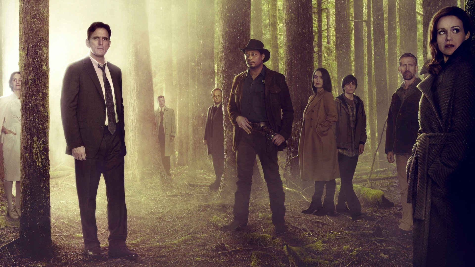 Wayward Pines TV show scene: group of characters in a misty pine forest with cinematic lighting — 2K Quad HD PC desktop wallpaper/background.
