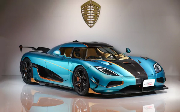 HD desktop wallpaper featuring a stunning blue Koenigsegg Agera supercar, showcasing its sleek design and high-performance build.