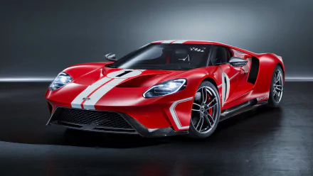 HD desktop wallpaper featuring a sleek red Ford GT supercar with white racing stripes, captured in a dark, minimalist background.