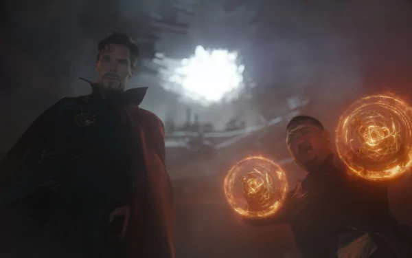 Benedict Cumberbatch as Doctor Strange and Benedict Wong as Wong in a dramatic scene from Avengers: Infinity War, featuring mystical energy effects, set against a dark and intense backdrop.