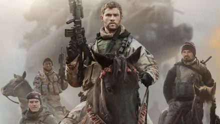Chris Hemsworth as Captain Mitch Nelson leads a military team on horseback in the movie 12 Strong, depicted in a dramatic HD desktop wallpaper.