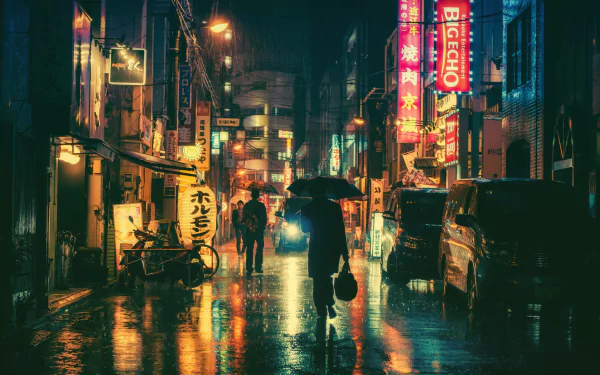 A rain-soaked Japanese city street at night, illuminated by vibrant neon signs and reflected lights, with pedestrians under umbrellas. This HD wallpaper captures the urban nightlife ambiance.