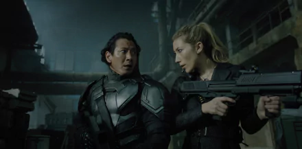 HD wallpaper of two characters from Altered Carbon in tactical gear, ready for action in a dim, industrial setting.