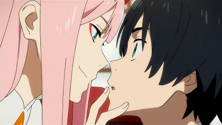 Hiro and Zero Two from Darling in the FranXX sharing a close moment, with Zero Two's pink hair contrasting Hiro's dark hair. This HD desktop wallpaper captures an intimate scene from the anime.