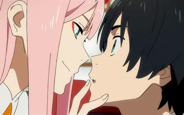 Hiro and Zero Two from Darling in the FranXX sharing a close moment, with Zero Two's pink hair contrasting Hiro's dark hair. This HD desktop wallpaper captures an intimate scene from the anime.