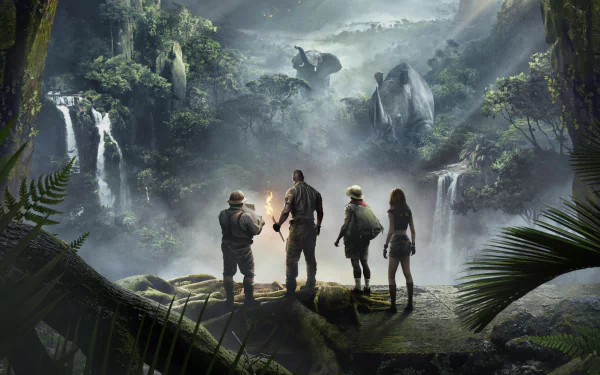 HD desktop wallpaper of Jumanji: Welcome to the Jungle with Kevin Hart, Karen Gillan, Jack Black, and Dwayne Johnson, featuring the group standing in an exotic jungle landscape with waterfalls.