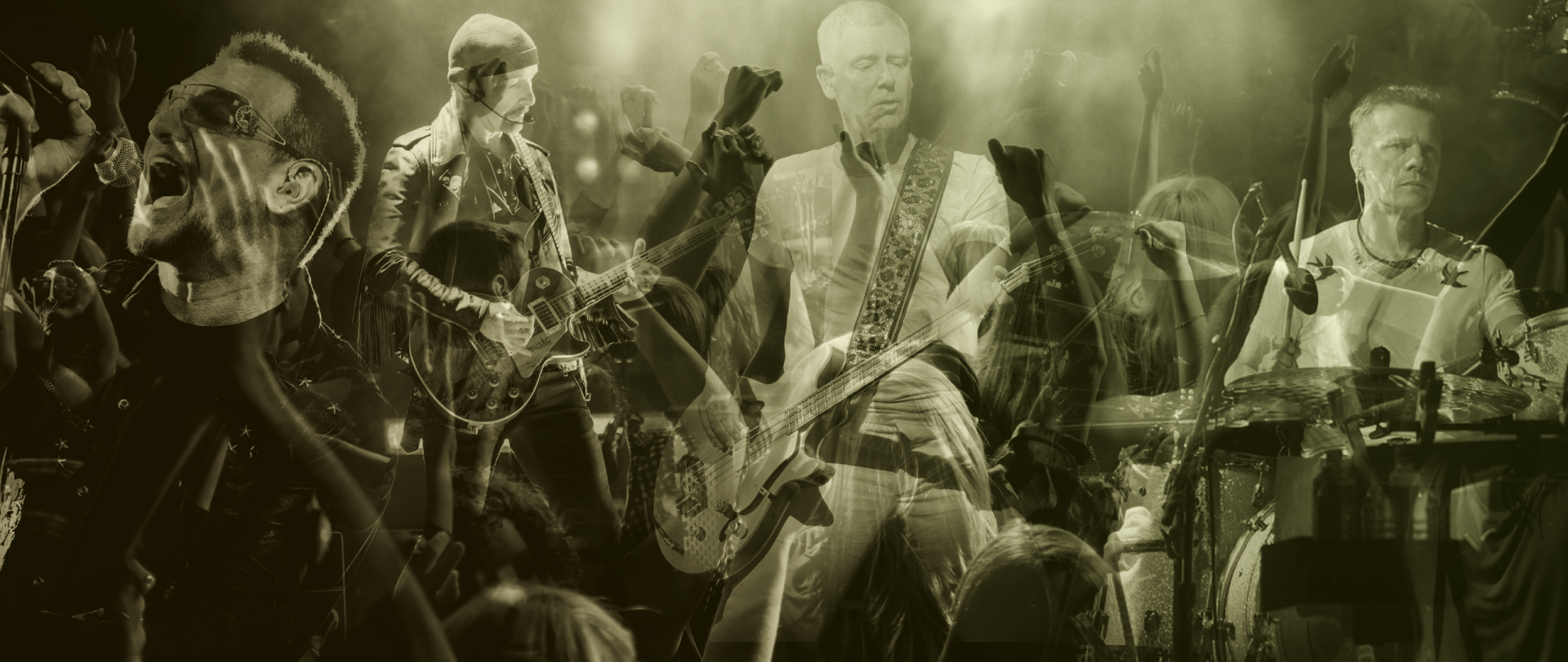 Sepia-toned HD PC desktop wallpaper of a live rock concert: guitarists on stage, bassist center, crowd with raised hands — music-themed background.