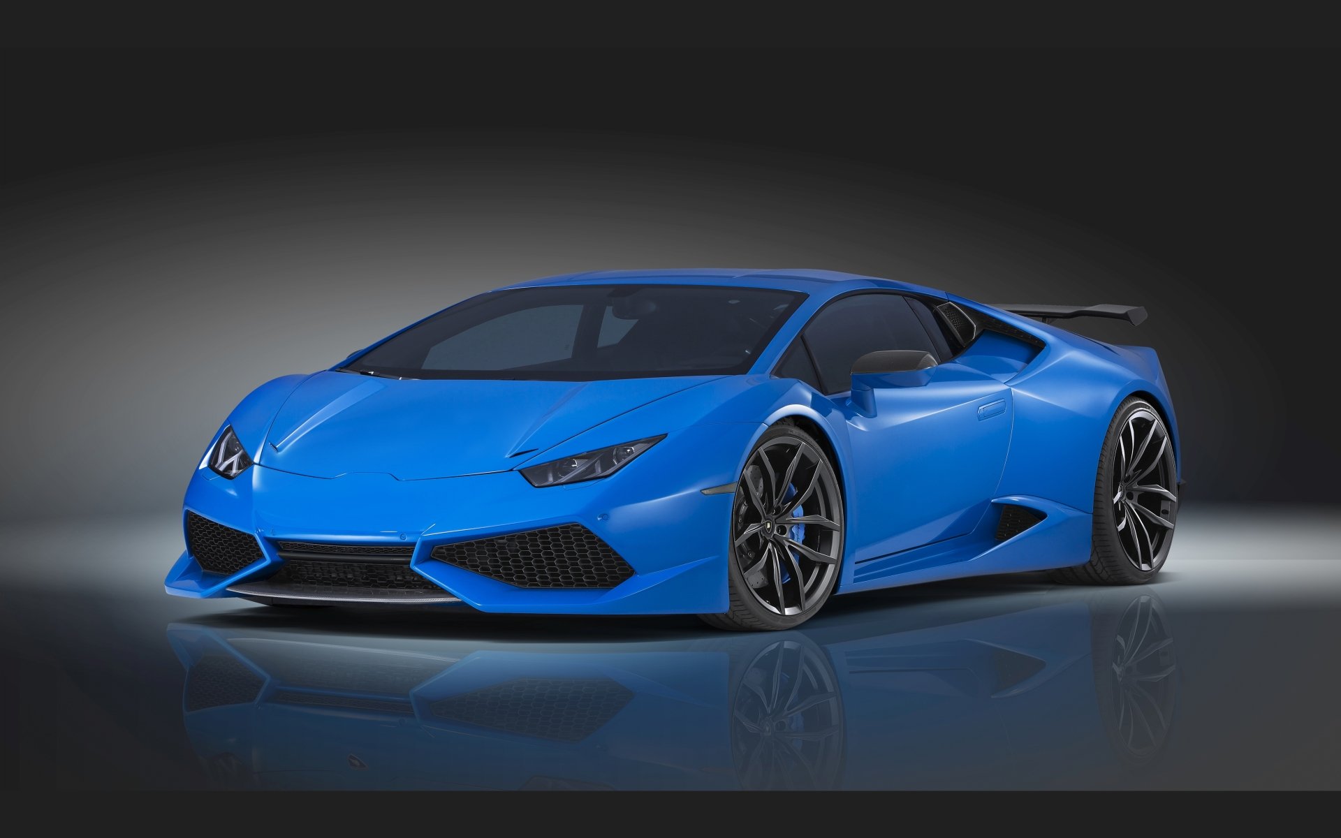 A vibrant blue Lamborghini Huracan LP 610-4 supercar showcased in a sleek 4K Ultra HD PC desktop wallpaper with a dark gradient background.