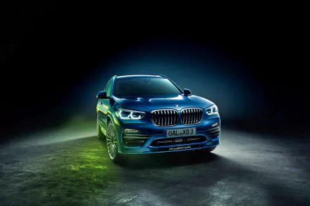 A sleek BMW X3 SUV car showcased in a dramatic 4K Ultra HD wallpaper with vibrant lighting and a dark, moody background.