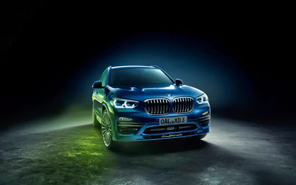 A sleek BMW X3 SUV car showcased in a dramatic 4K Ultra HD wallpaper with vibrant lighting and a dark, moody background.