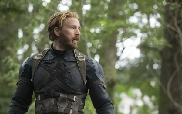 HD desktop wallpaper featuring Chris Evans as Captain America from the movie Avengers: Infinity War, portraying the character in a forest setting with a pensive expression.