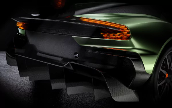 A close-up of the rear of an Aston Martin Vulcan hypercar race car, showcasing its sleek design and aggressive aerodynamic features in 4K Ultra HD quality.