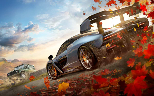 HD wallpaper featuring a dynamic scene from Forza Horizon 4 with a sports car and an off-road vehicle on a dirt road, surrounded by falling autumn leaves.