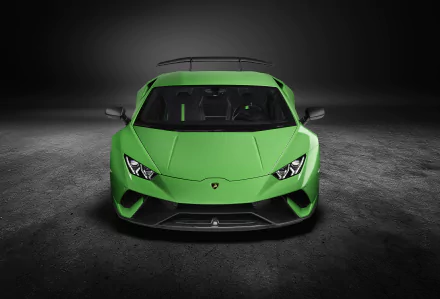 Front view of a green Lamborghini Huracan Performante supercar on a dark, textured surface, captured in 4K Ultra HD for a PC desktop wallpaper.