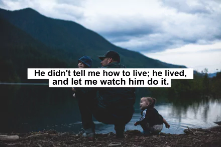 Inspirational HD desktop wallpaper featuring a motivational quote over a serene lakeside scene with a man and child, emphasizing living by example.