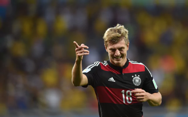 HD PC desktop wallpaper featuring German soccer player Toni Kroos in the national team jersey during a match.