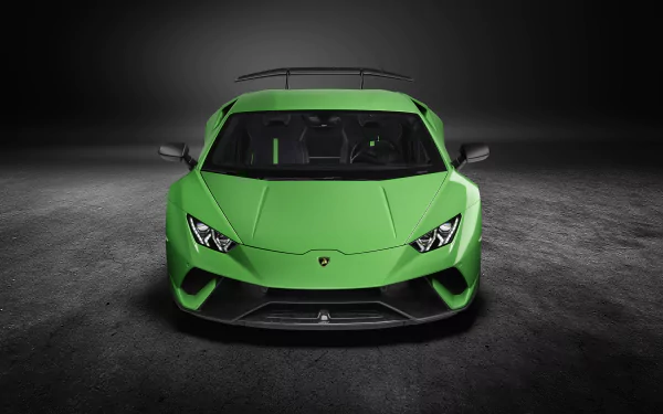Front view of a green Lamborghini Huracan Performante supercar on a dark, textured surface, captured in 4K Ultra HD for a PC desktop wallpaper.