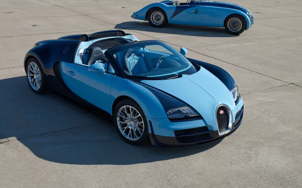 Two-tone blue Bugatti Veyron 16.4 Grand Sport Vitesse convertibles on a concrete apron, one in the foreground and another behind — 2K Quad HD PC desktop wallpaper/background