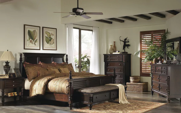 HD desktop wallpaper of a man-made bedroom featuring dark wood furniture, a bed, dresser, nightstands, and decorative plants in a well-lit room.