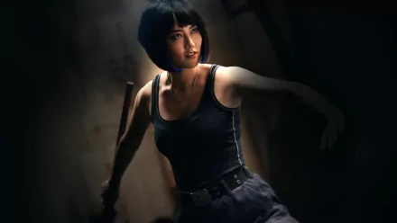 HD desktop wallpaper featuring a focused individual from Pacific Rim, resembling Rinko Kikuchi, set against a shadowy backdrop.