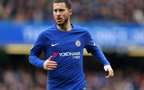 Eden Hazard in action, wearing the Chelsea FC blue kit during a match. This high-definition image serves as a dynamic sports desktop wallpaper.