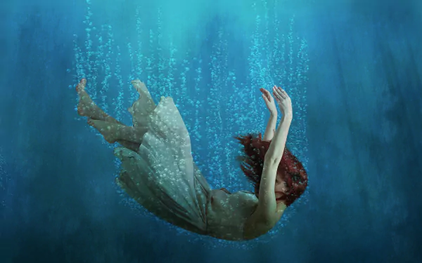 Artistic HD fantasy wallpaper of a red-haired woman falling gracefully underwater, surrounded by bubbles and soft light.