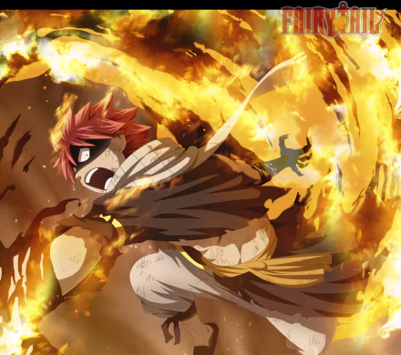HD PC desktop wallpaper featuring Natsu Dragneel from the anime Fairy Tail, engulfed in fiery flames with intense action and vibrant orange tones.