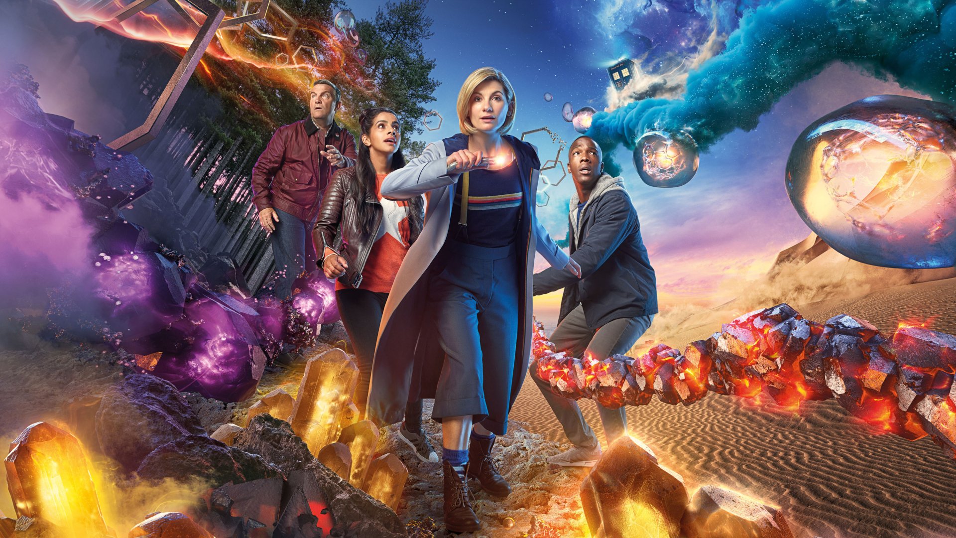 HD PC desktop wallpaper featuring Jodie Whittaker as the Doctor in the TV show Doctor Who (2005), surrounded by vibrant sci-fi elements and companions.
