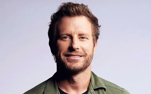 HD desktop wallpaper and background featuring a smiling man in a green shirt, providing a vibrant and personable ambiance.