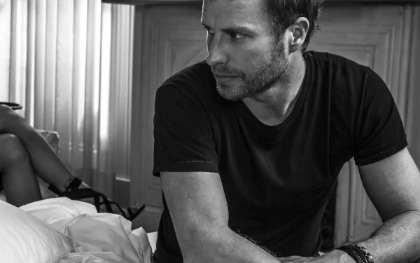 HD desktop wallpaper featuring a monochrome image of Dierks Bentley in a contemplative pose.