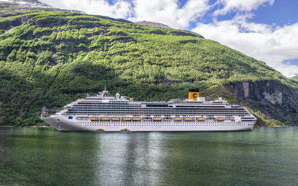 Cruise ship Costa Favolosa sails through calm waters with lush green Norwegian mountains in the background, captured in HD for a vibrant PC desktop wallpaper.