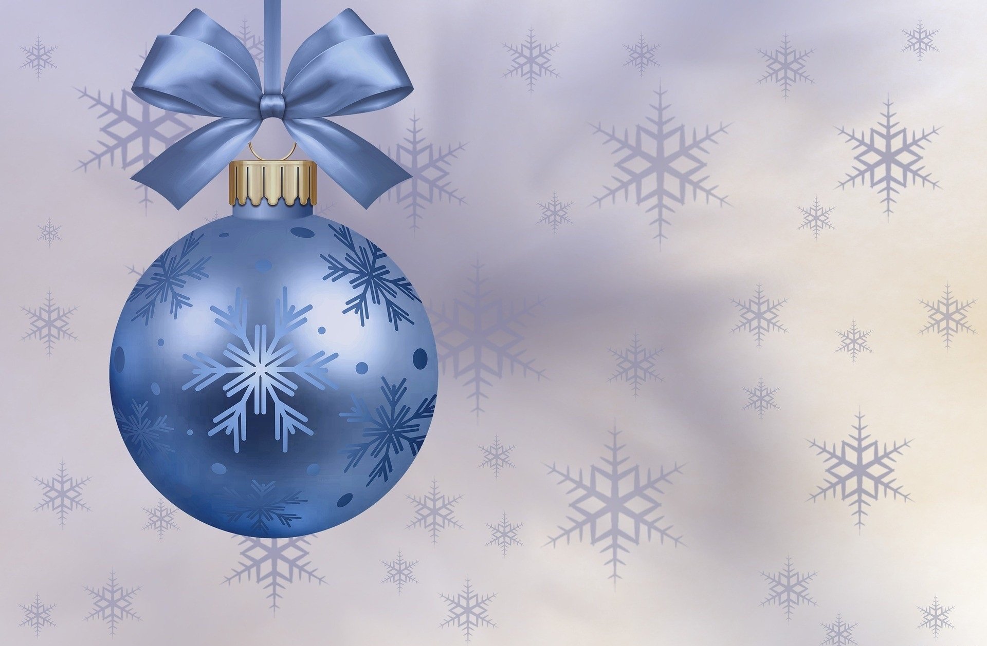 HD desktop wallpaper featuring a blue Christmas bauble adorned with snowflakes, hanging from a ribbon, set against a soft background with snowflake patterns.