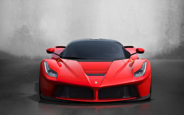 A sleek red Ferrari LaFerrari supercar showcased against a minimalist gray background in stunning 4K Ultra HD as a PC desktop wallpaper and background.