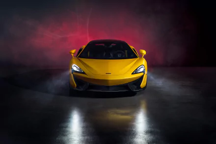 Front view of a yellow McLaren 570S supercar against a dark, smoky background, captured in 4K Ultra HD for a striking PC desktop wallpaper.