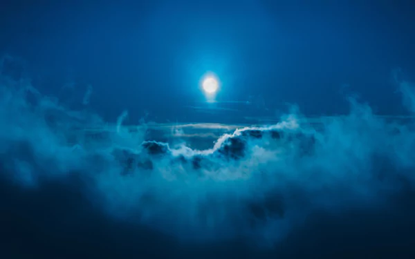 HD desktop wallpaper: A serene night scene of the moon illuminating a sky filled with wispy clouds, highlighting nature's tranquil beauty.
