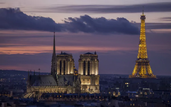 HD wallpaper of Paris at dusk featuring illuminated landmarks Sacré-Cœur, Notre-Dame cathedral, and the glowing Eiffel Tower against a dramatic sky.