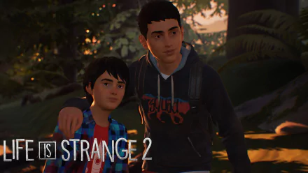 HD PC desktop wallpaper from the video game Life Is Strange 2: two brothers walking through a dusky forest, older brother's arm around younger, game logo in corner.