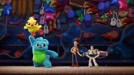 4K Ultra HD Toy Story 4 wallpaper featuring Woody, Buzz Lightyear, and colorful characters from Pixar’s Toy Story movie against a vibrant carnival background.